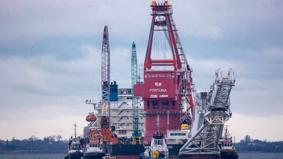 FILE - In this Jan. 14, 2021, file photo, tugboats get into position on the Russian pipe-laying vessel "Fortuna" in the port of Wismar, Germany. The world's facing an energy crunch. Europe is feeling it worst as natural gas prices skyrocket to five t