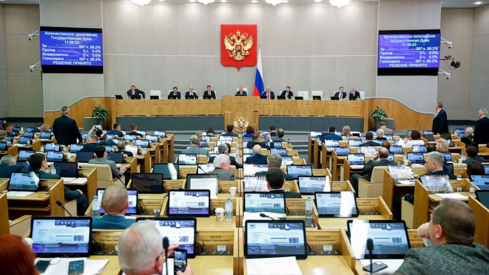 In this handout photo provided by The State Duma, The Federal Assembly of The Russian Federation, Russian lawmakers attend a session of the State Duma, the Lower House of the Russian Parliament in Moscow, Russia, Thursday, Nov. 24, 2022. Russian lawm