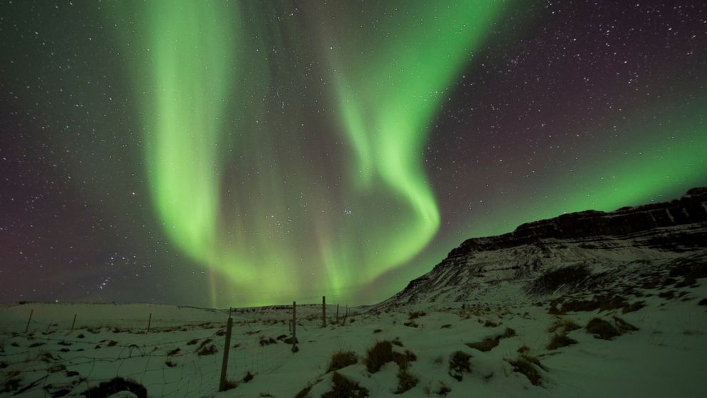 FILE - In this March 1, 2017 file photo, the Northern Lights, or aurora borealis, appear in the sky over Bifrost, Western Iceland. Police in Iceland say tourists are often putting themselves at risk searching for the Northern Lights, whose spectacula