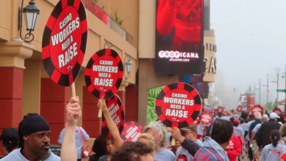 Union members picket outside the Tropicana casino in Atlantic City N.J. on June 1, 2022. The main casino workers union is threatening a strike against at least 5 casinos in July if new contracts are not reached by then, and on Wednesday, June 22, the