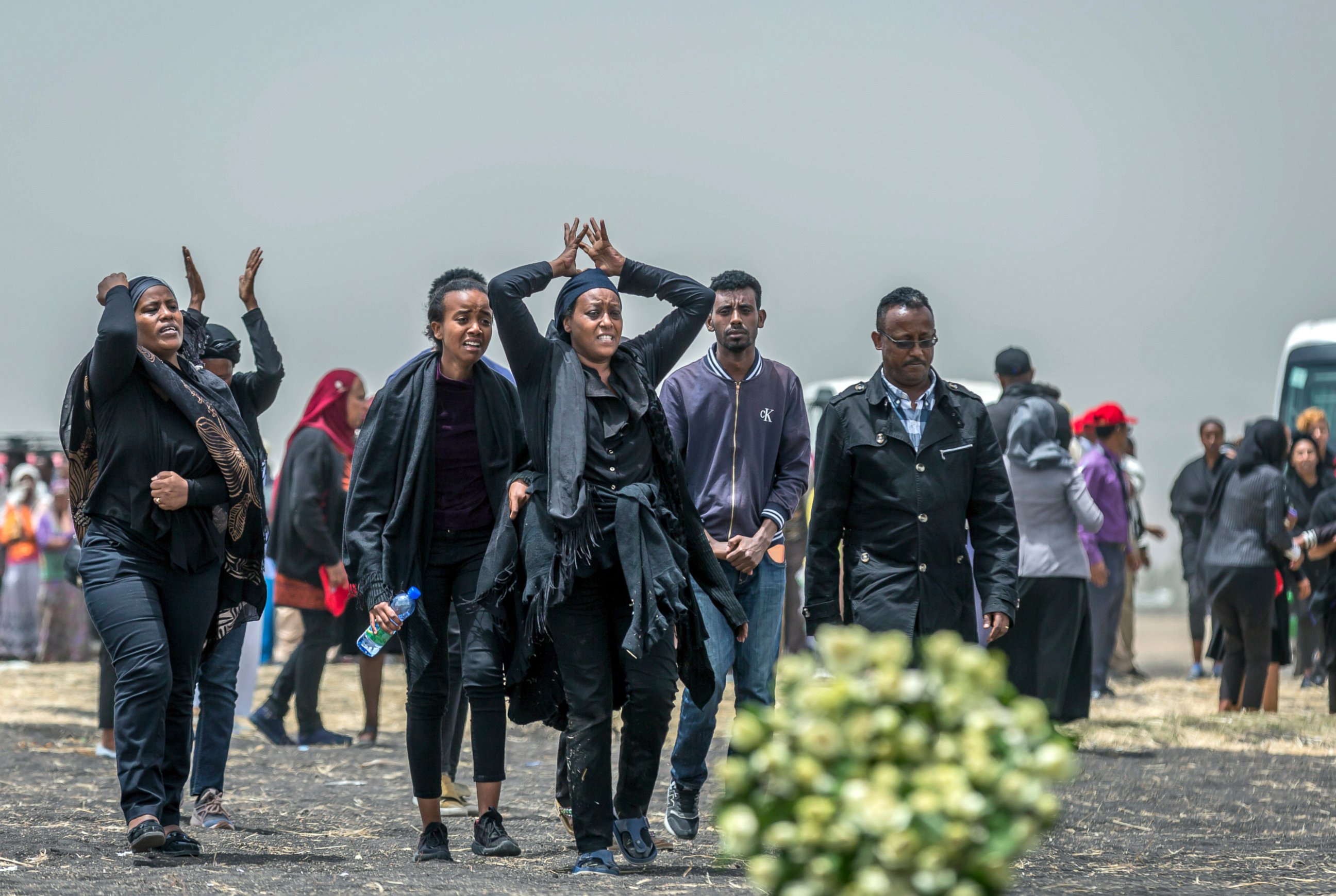FILE - In this March 14, 2019 file photo, Ethiopian relatives of crash victims mourn at the scene where the Ethiopian Airlines Boeing 737 Max 8 crashed shortly after takeoff on Sunday killing all 157 on board, near Bishoftu, south-east of Addis Ababa