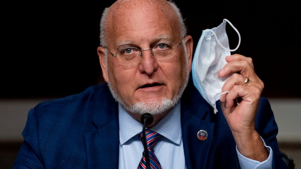 Centers for Disease Control and Prevention Director Dr. Robert Redfield holds up his mask as he speaks at a Senate Appropriations subcommittee hearing on a "Review of Coronavirus Response Efforts" on Capitol Hill, Wednesday, Sept. 16, 2020, in Washin