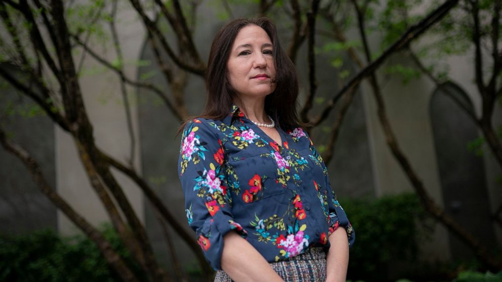Allyson Jacobs stands for a portrait outside her workplace, Wednesday, May 4, 2022, in New York. For Jacobs, life in her 20s and 30s was about focusing on her career in health care and enjoying the club scene in New York City. It wasn't until she tur