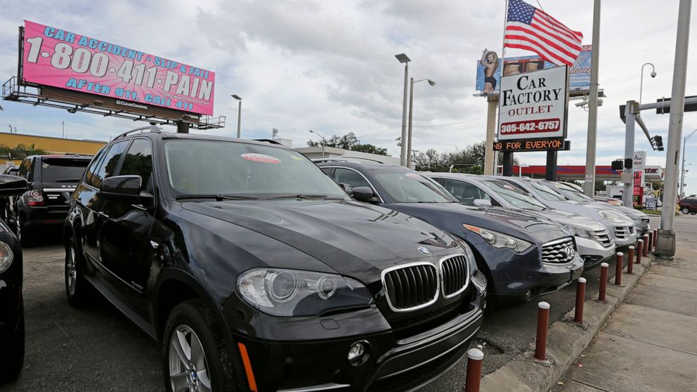FILE - In this Tuesday, Jan. 17, 2017, file photo, certified pre-owned vehicles sit on display at an auto dealership in Miami. Obtaining a vehicle history report is an integral part of any used-car purchase. It’s one of the best ways to learn about a