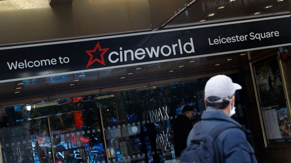 FILE - A man walks past a Cineworld cinema in Leicester Square, London, on Oct. 5, 2020. Cineworld Group PLC, the world's second-largest chain of movie theaters, said Monday Aug. 22, 2022 that it is considering filing for Chapter 11 bankruptcy protec