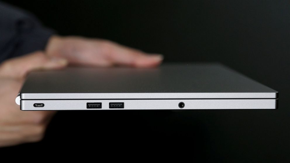 FILE - This Tuesday, March 10, 2015 photo shows, from left, the USB Type-C port, two standard USB ports, and headphone jack on a laptop, in San Jose, Calif. Compared with larger companies, many small businesses have fewer resources to dedicate to cyb