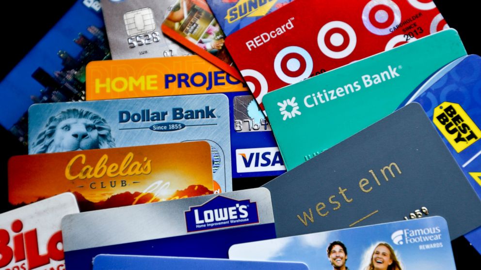 FILE- In this Jan. 31, 2018, file photo, an assortment of credit cards and rewards cards are shown in Zelienople, Pa. Rewards-earning credit cards can help you save on these expenses — but you can also combine those rewards with other money-saving st