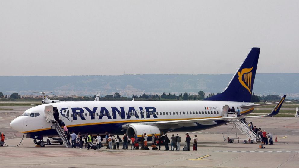 FILE- In this Wednesday, May 13, 2015 file photo passengers disembark a Ryanair plane, at the Marseille Provence airport, in Marignane, southern France. Budget airline Ryanair, Europe’s biggest carrier by passengers, has warned its profits will be lo