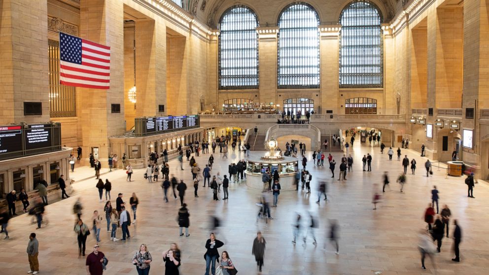 FILE - Commuters pass through Grand Central Terminal on March 10, 2020 in New York. Millennials are known for changing jobs often, but how does that affect their retirement savings? That depends on several factors. It’s a good idea to weigh the pros 