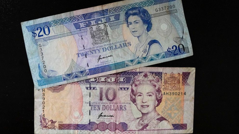 Fiji $10 and $20 bills bills are pictured in Sydney, Saturday, Sept. 10, 2022. As the United Kingdom's reigning monarch, Queen Elizabeth II was depicted on British bank notes and coins for decades. It's less well known that her portrait was featured 