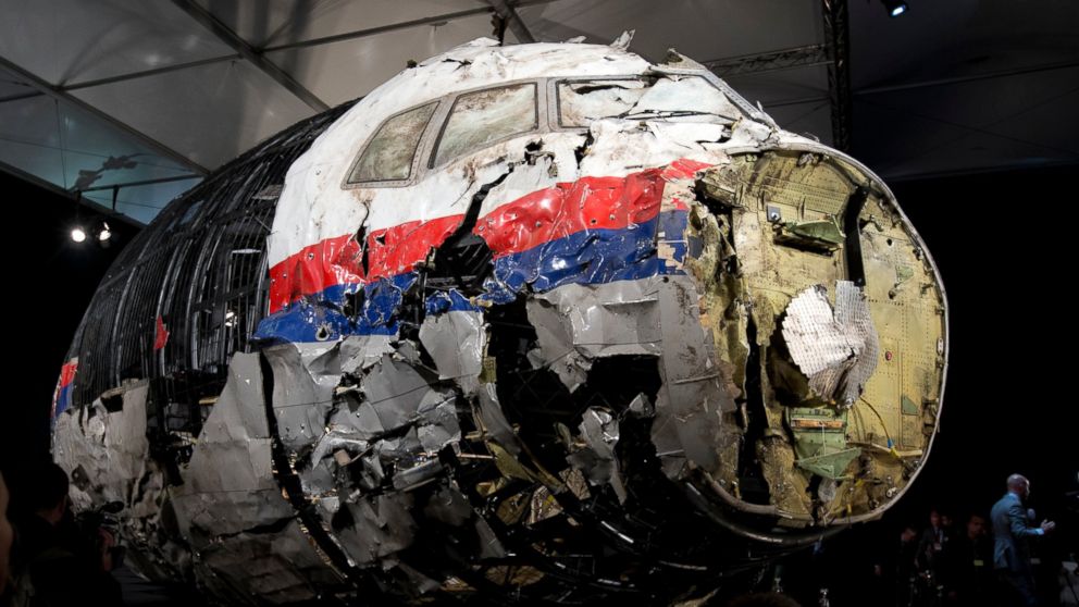 FILE - This Tuesday, Oct. 13, 2015 file photo, shows the reconstructed wreckage of Malaysia Airlines Flight MH17, put on display during a press conference in Gilze-Rijen, central Netherlands. Malaysia Airlines Flight 17 broke up high over Eastern Ukr