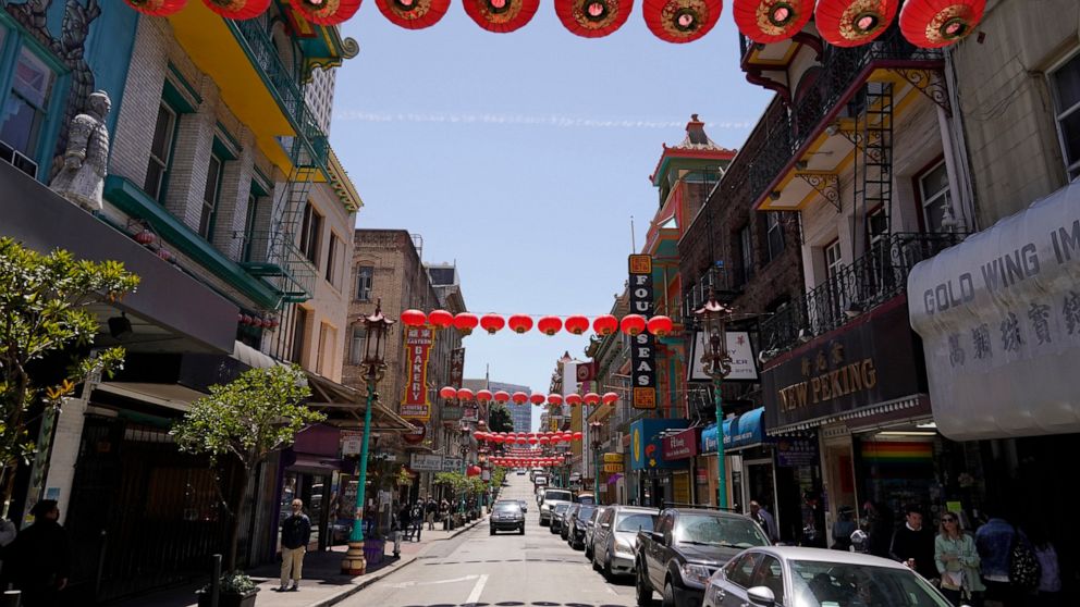 Lanterns hang in Chinatown above Grant Avenue in San Francisco, Monday, May 23, 2022. Chinatowns and other Asian American enclaves across the U.S. are using art and culture to show they are safe and vibrant hubs nearly three years after the start of 
