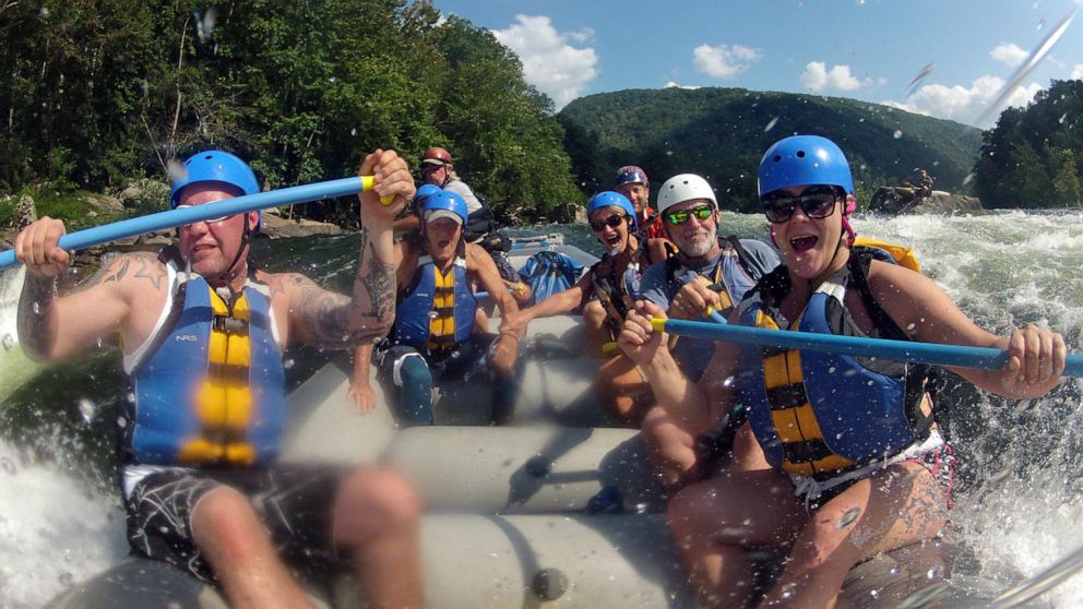 FILE - In this Aug. 30, 2012 file photo whitewater rafters are shown rafting the lower New River Gorge, near Fayetteville, W.Va. A program launched Monday, April 12, 2021, will try to lure outdoor enthusiasts to live and work in West Virginia with en