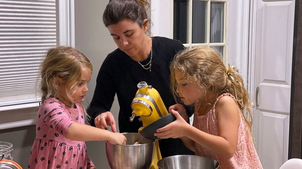Danielle McWilliams cooks with her daughters Reese, 7, right, and Remi, 4, at their New Jersey home. Along with the usual cupcakes, crispy treats and from-scratch cookies, they make tarallis, an Italian family traditional treat that’s a cross between