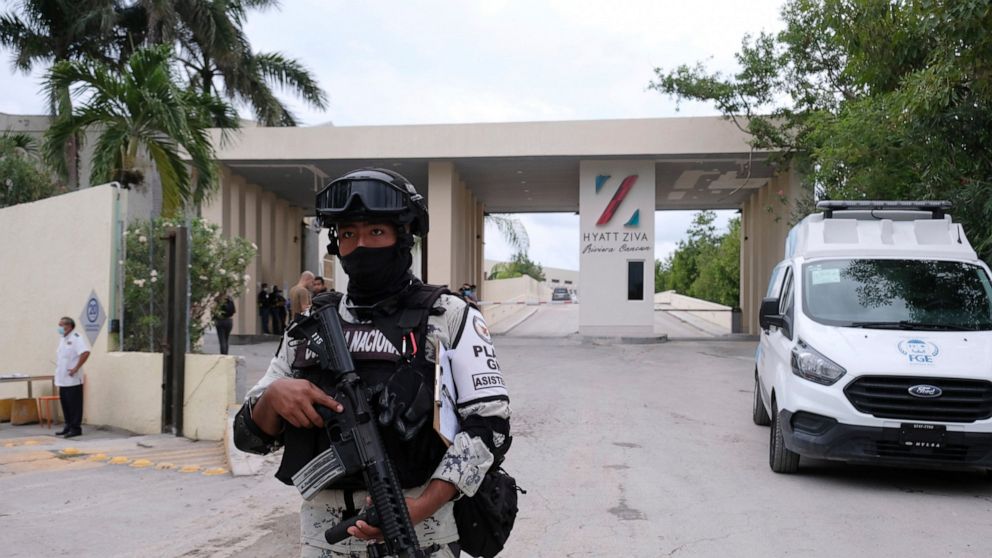 Government forces guard the entrance of hotel after an armed confrontation near Puerto Morelos, Mexico, Thursday, November 4, 2021. Two suspected drug dealers were killed after gunmen from competing gangs staged a dramatic shootout near upscale hotel