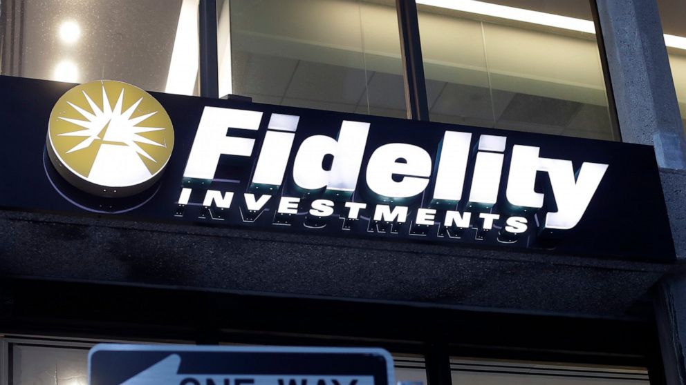 FILE - In this Oct. 14, 2019 file photo a Fidelity Investments logo is attached to a building, in Boston. Fidelity is launching a new type of account for teenagers to save, spend and invest their money. The account is for 13- to 17-year-olds, and it 