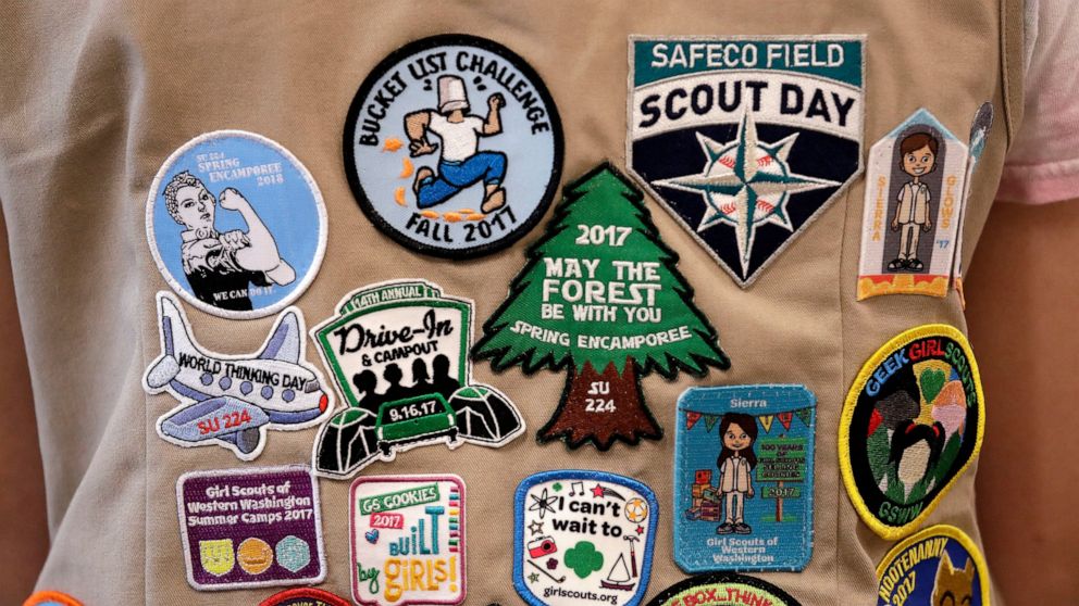 FILE - In this June 18, 2018, file photo, patches cover the back of a Girl Scout's vest at a demonstration of some of their activities in Seattle. Girl Scouts of the United States of America claim the century-old organization is in a "highly damaging