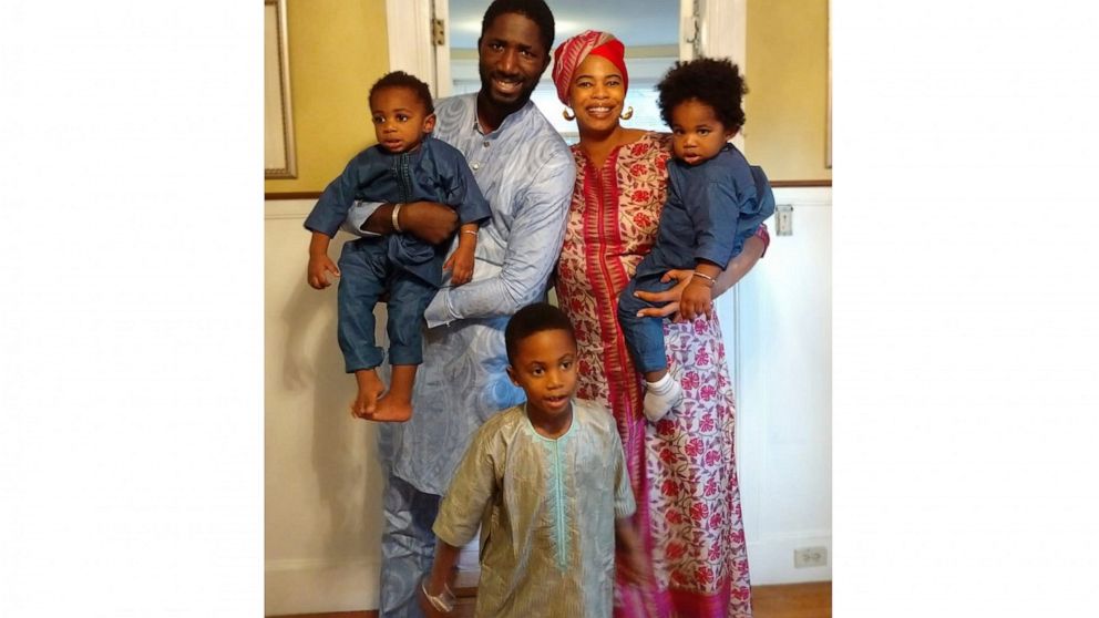 This 2019 photo shows Bouba Diemé with his wife, Désirée Allen, their 5-year-old son, Buraq Abdou, center, and twin 1-year-olds, Sembène Khalifa, held by Diemé, and Sankara Kokà. Diemé said the family’s isolation during lockdown due to the coronaviru