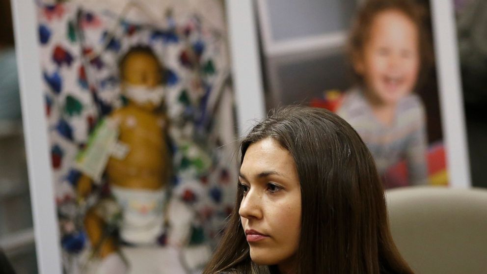 FILE -- In this April 24, 2019 file photo Alyssa Hernandez listens as opponents to a proposal to give state public health officials instead of local doctors the power to decide which children can skip their shots before attending school, speak at the