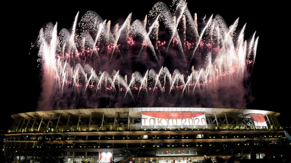 FILE - In this July 23, 2021, file photo, fireworks illuminate over the National Stadium during the opening ceremony of the 2020 Summer Olympics in Tokyo. The price tag for the Tokyo Olympics is $15.4 billion. Tokyo built eight new venues. The two mo