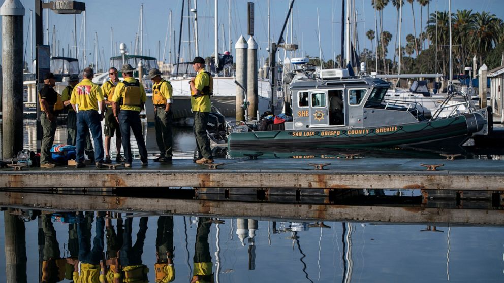 Divers with the San Luis Obispo County Sheriff's Dive Team prepare to search for a second day for missing people following a dive boat fire off Southern California's coast that killed dozens sleeping below deck, in Santa Barbara, Calif., Tuesday, Sep