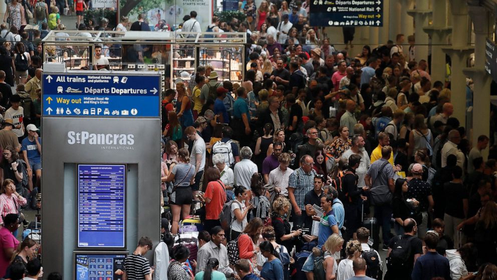 People wait at the St Pancras International train station to board the Eurostar in London, Friday, July 26, 2019. A power outage at one of France's busiest train stations is disrupting travel on the Eurostar to and from London and other routes around