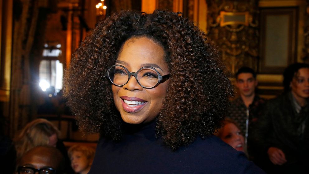 FILE - Oprah Winfrey arrives for the presentation of Stella McCartney's ready-to-wear Fall-Winter 2019-2020 fashion collection in Paris on March 4, 2019. Winfrey is setting aside her usual book club recommendations and instead citing seven personal f