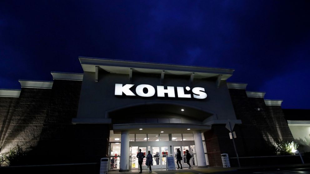 FILE - In this Friday, Nov. 29, 2019 file photo, customers walk outside of a Kohl's store in Colma, Calif. Even though the holiday season is winding down, you can still get a good bargain. Go to stores in person to avoid costly online shipping fees a