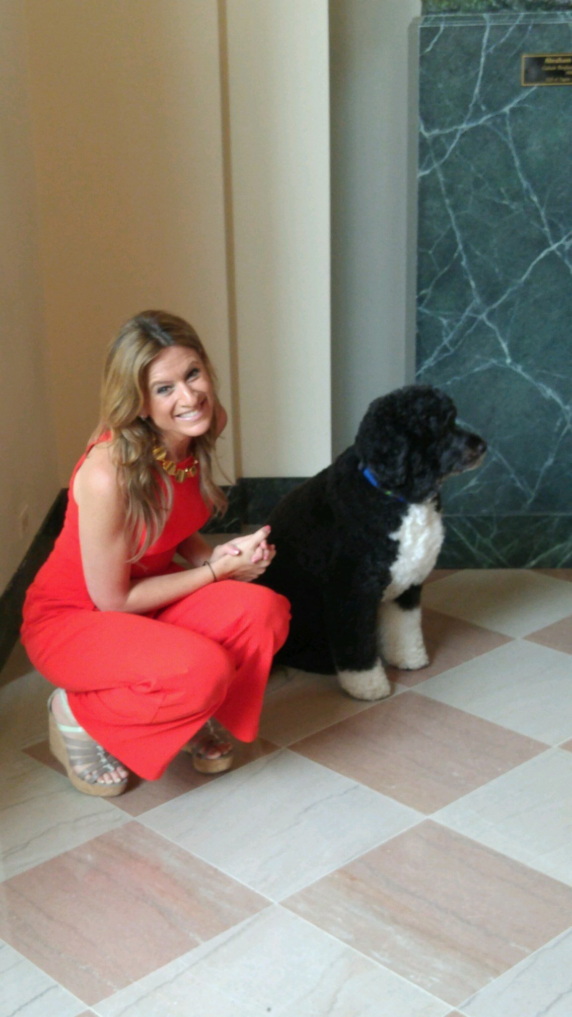PHOTO: Co-founder of The MOMS Denise Albert smiles with Bo on the first White House tour to permit photography.