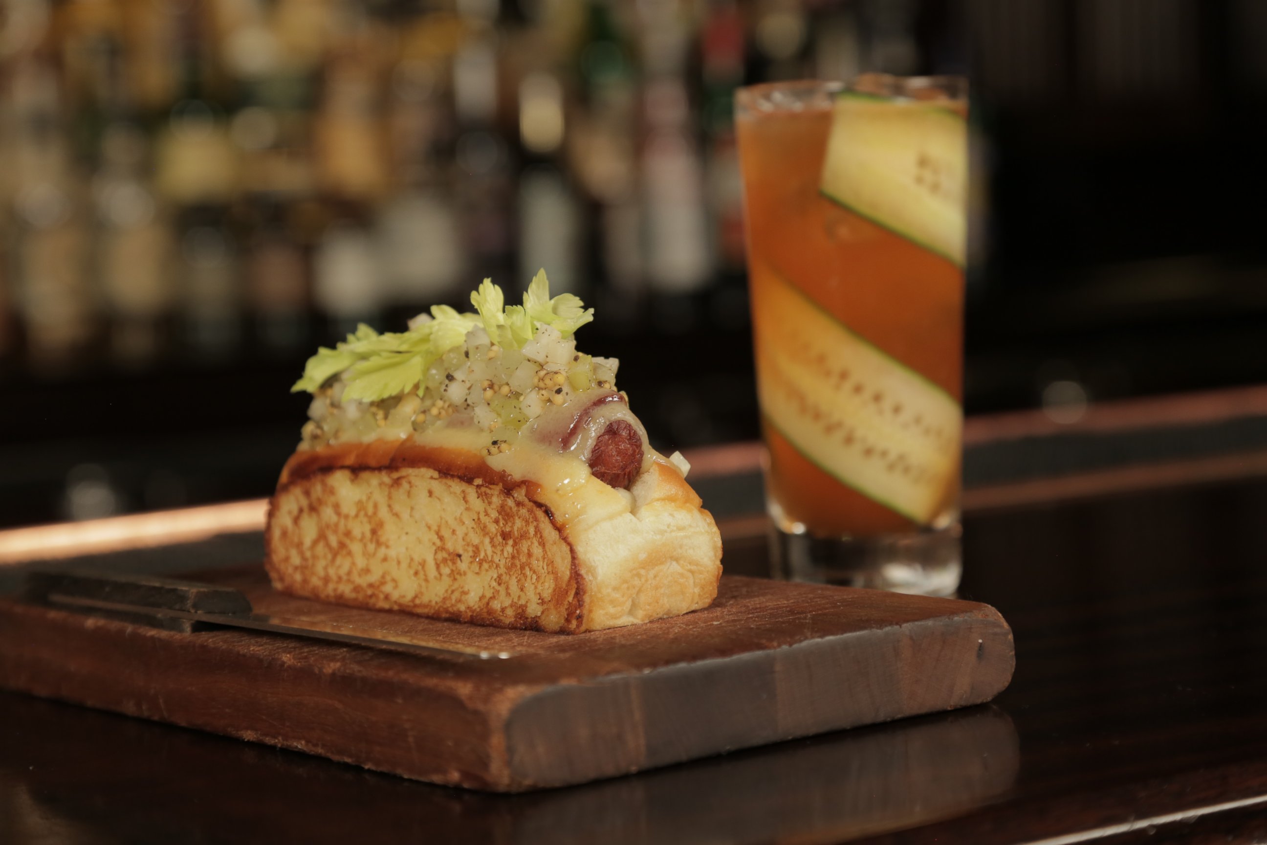 PHOTO: The "Humm Dog" is a bacon wrapped hot dog with truffle mayonnaise, Gruyere, truffle celery relish and celery leaves. 