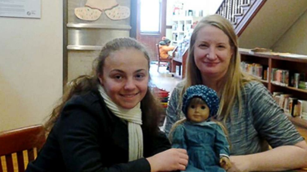 PHOTO: Olivia Reduto, left, poses with Thea Taube, Children's Librarian at Ottendorfer Branch of the New York Public Library, whose American Girl dolls project inspired Reduto.