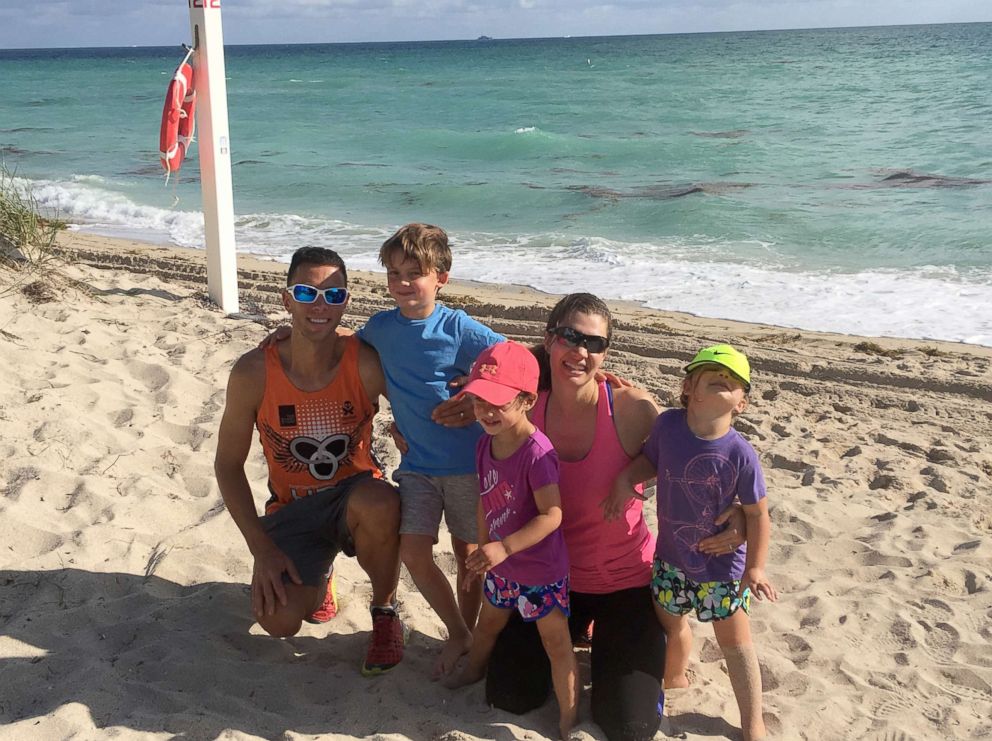 PHOTO: Dr. Anne Peled, smiles with her husband, Ziv, a fellow triathelete and runner, and their children, Simon, 7, and twins, Charlotte and Eveline, 4, at Miami Beach on Thanksgiving 2017, just before her diagnosis.