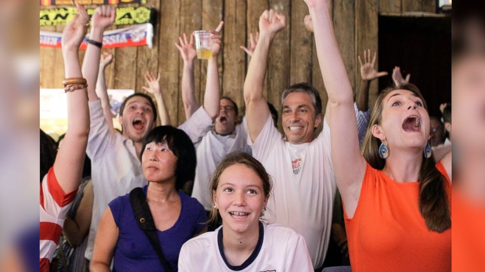 Fans cheer as they watch a broadcast of a United States women's soccer match at the 2012 Summer Olympics on Aug. 9, 2012, at Nevada Smiths bar in New York.