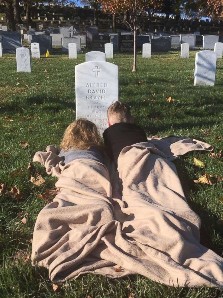 PHOTO: Mason and Mylan Brazel visited their father's grave to see his headstone for the first time last month at Arlington National Cemetery.