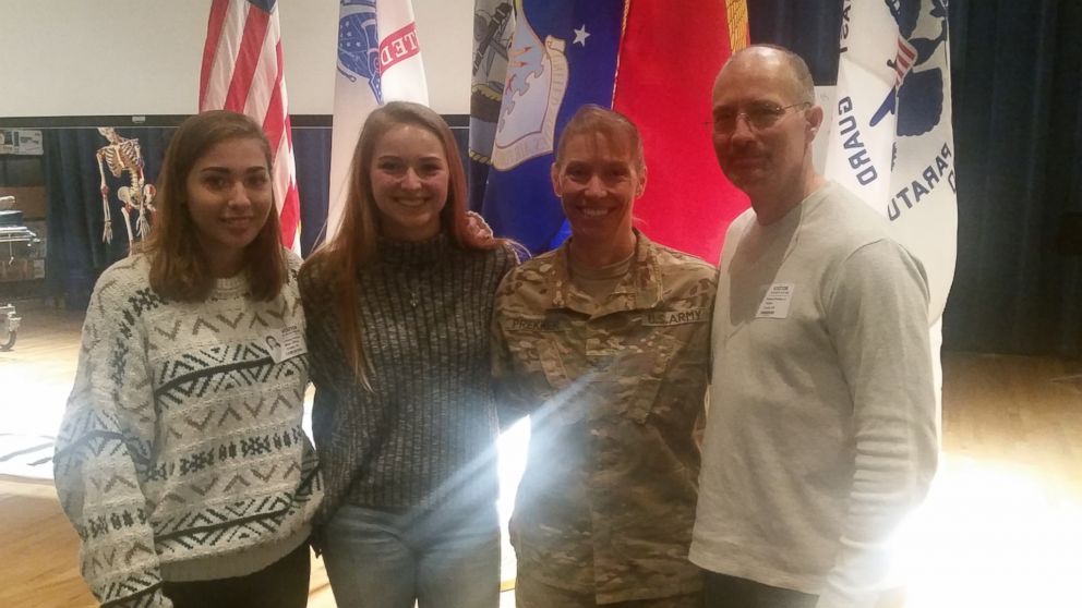 PHOTO: Army Mom Home From Iraq Surprises Two Daughters at High School