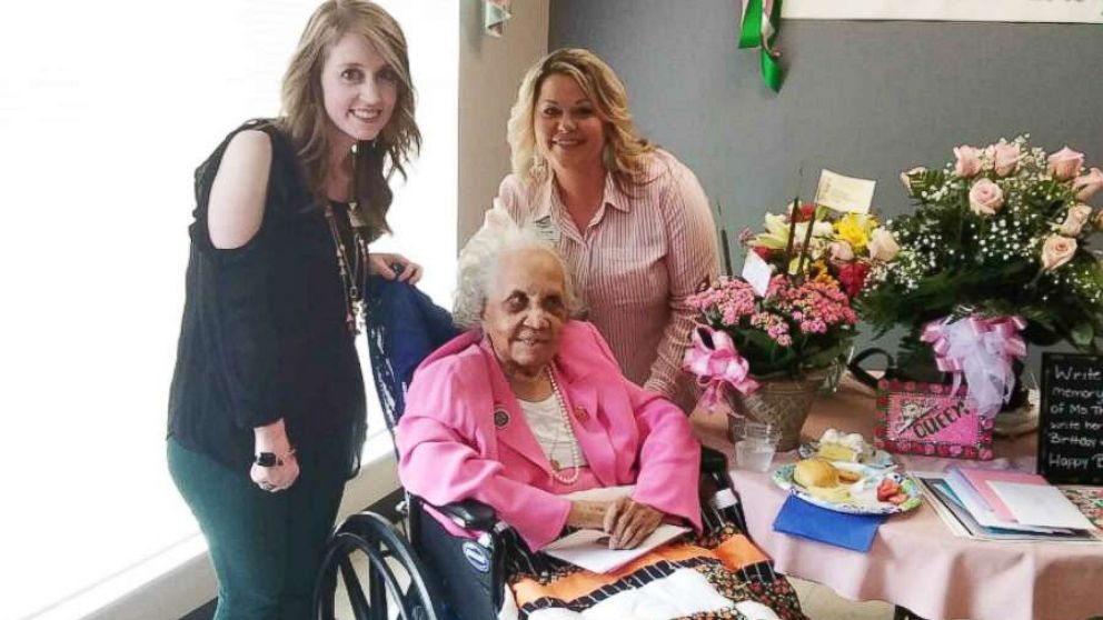 PHOTO: Stratford Activities Director Kim Holley and Director of Nursing Karen Baise flank Avicia Thorpe while posing for a photo at her birthday celebration in Danville, Va., April 16, 2018.