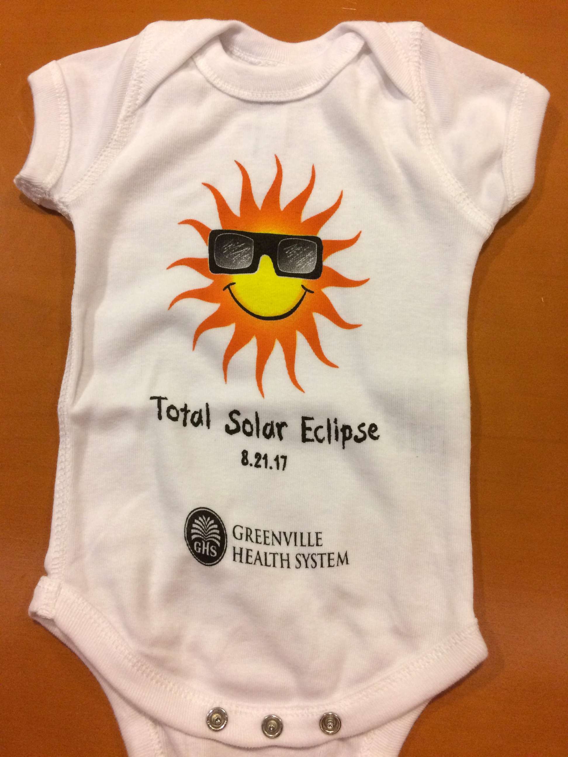 PHOTO: Greenville Memorial Hospital gifted 11 babies who were born on the day of the total solar eclipse a souvenir onesie.

