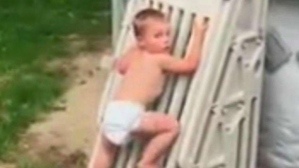 PHOTO: Cody Wyman, 2, is seen climbing the safety gate of an above-ground pool.