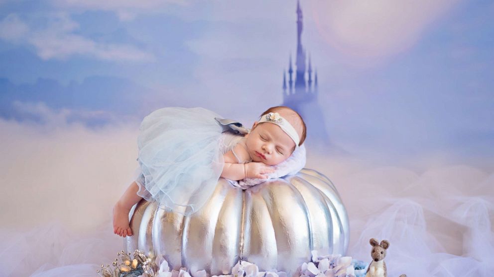 PHOTO: A photographer turned newborn babies into Disney princesses for a magical photo shoot. 