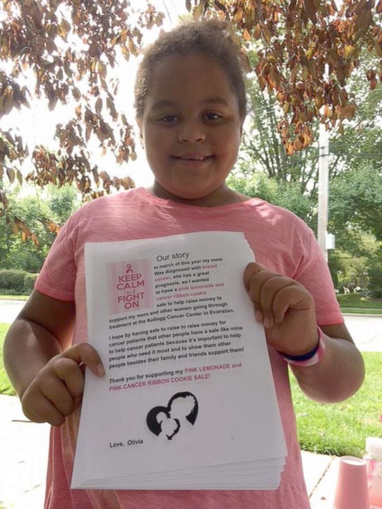 PHOTO: Olivia Ohlson, 10, holds a flier she made for a bake sale in her Evanston, Illinois, neighborhood to raise money for people affected by breast cancer.