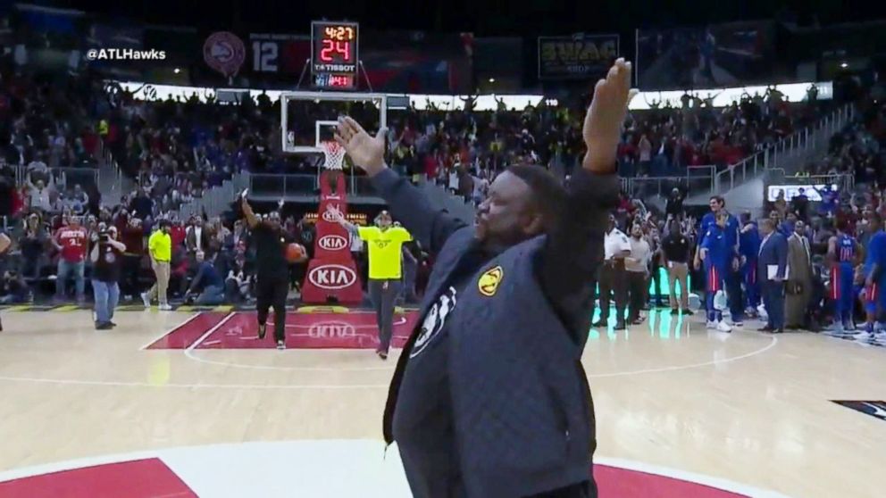 PHOTO: Norman's reaction to his incredible half-court shot was priceless.