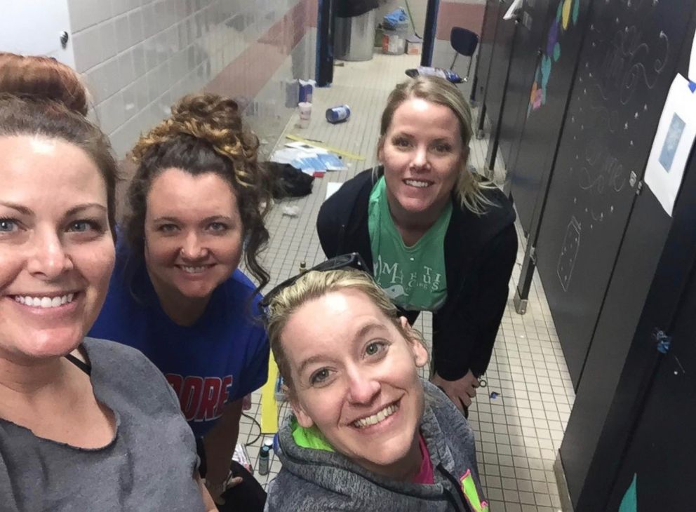 PHOTO: Tammy Duhon, Kelsey Dwyer, Heather Hallman and Tamara Castaldo, left to right, decorate a bathroom at Mary Moore Elementary School.