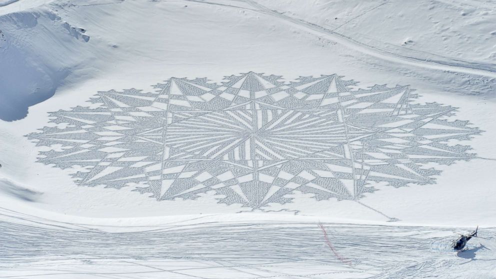 Artist creates massive murals in snow all over the world using just his ...