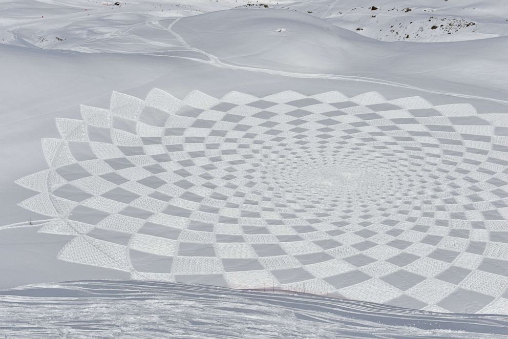 PHOTO: Simon Beck creates intricate geometric designs in the snow using only his feet strapped to snow shoes.