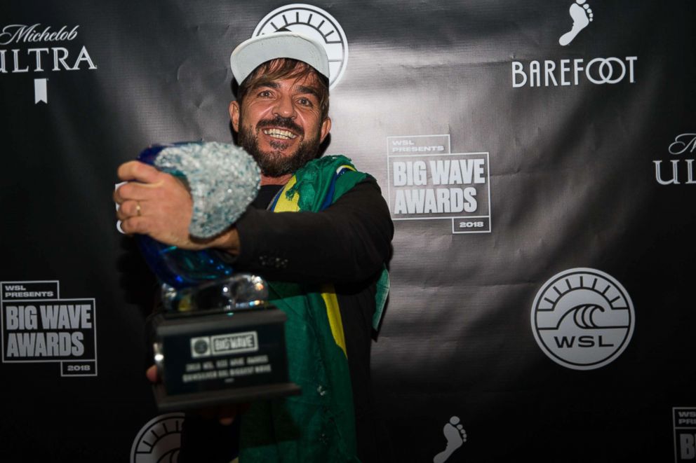 PHOTO: Surfer Rodrigo Koxa of Brasil hugs his award at the 2018 WSL Big Wave Awards in Santa Monica, Calif., April 28, 2018.