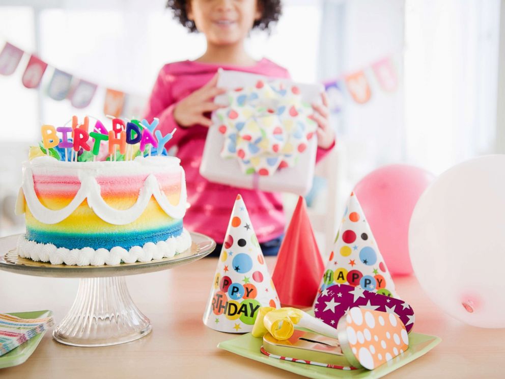 PHOTO: A girl holds a gift at birthday party in this undated stock photo.