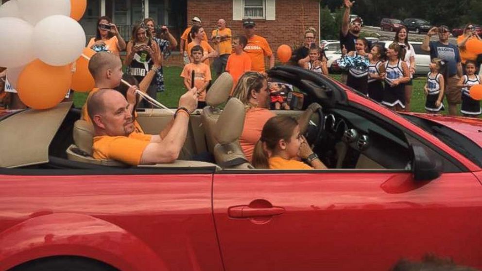 Neighbors surprise 6-year-old with birthday parade as he returns