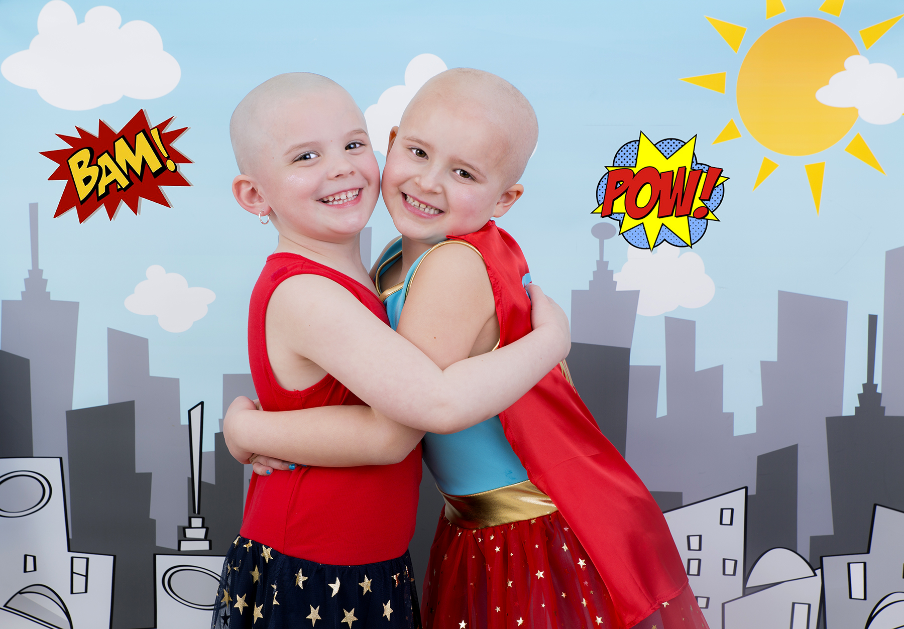PHOTO: Ella Watters, 6, poses with her friend Emma Zielinski, 5, who shaved her head for her. 