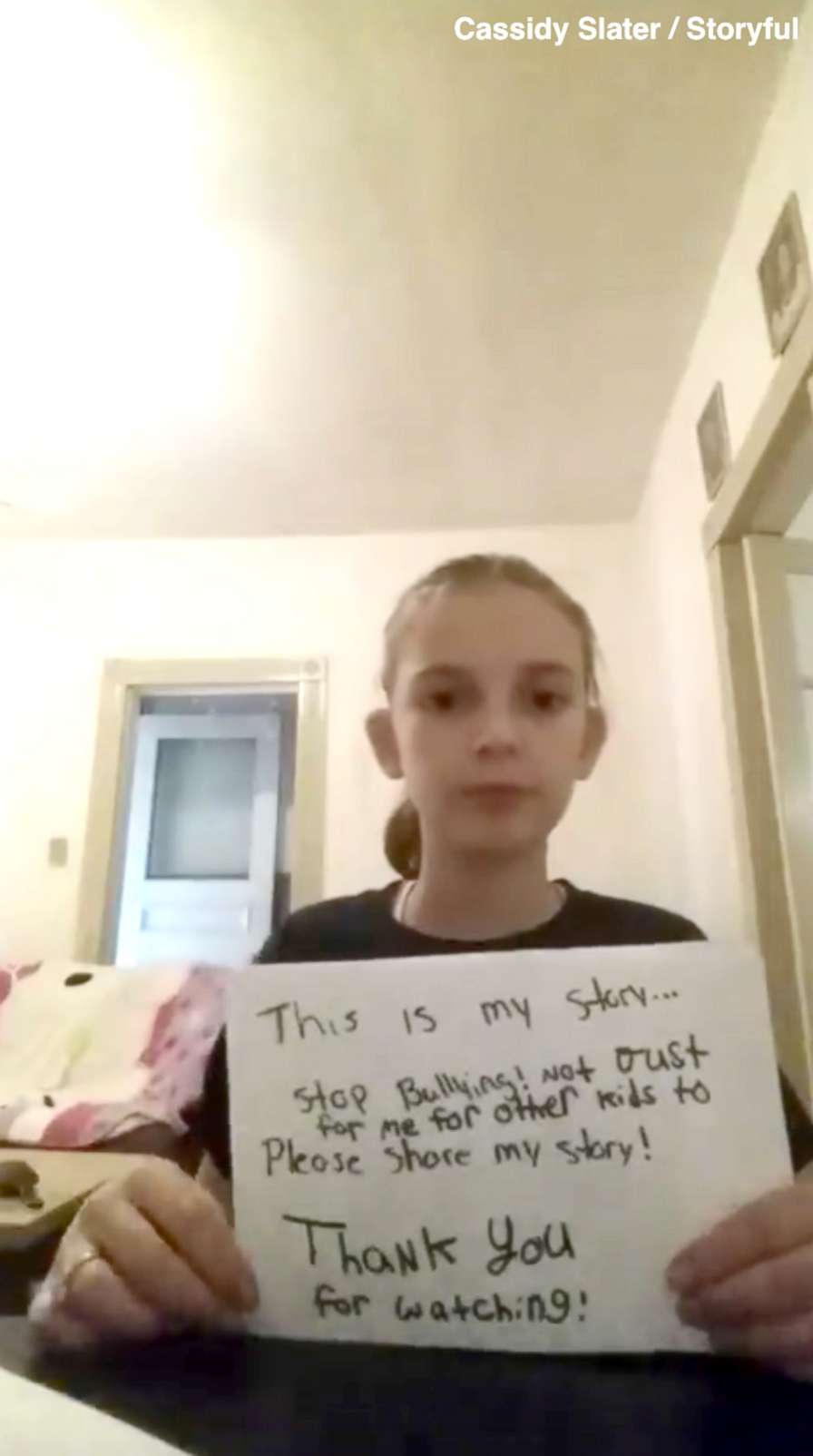 PHOTO: A fourth grader named Cassidy appears in video holding signs up describing how she has been bullied since first grade.