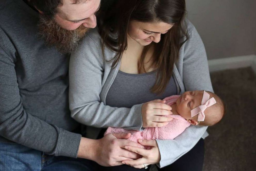 PHOTO: Chelsea and Jamie Cardinal look lovingly at their daughter, Remy, born Jan. 11, 2017.